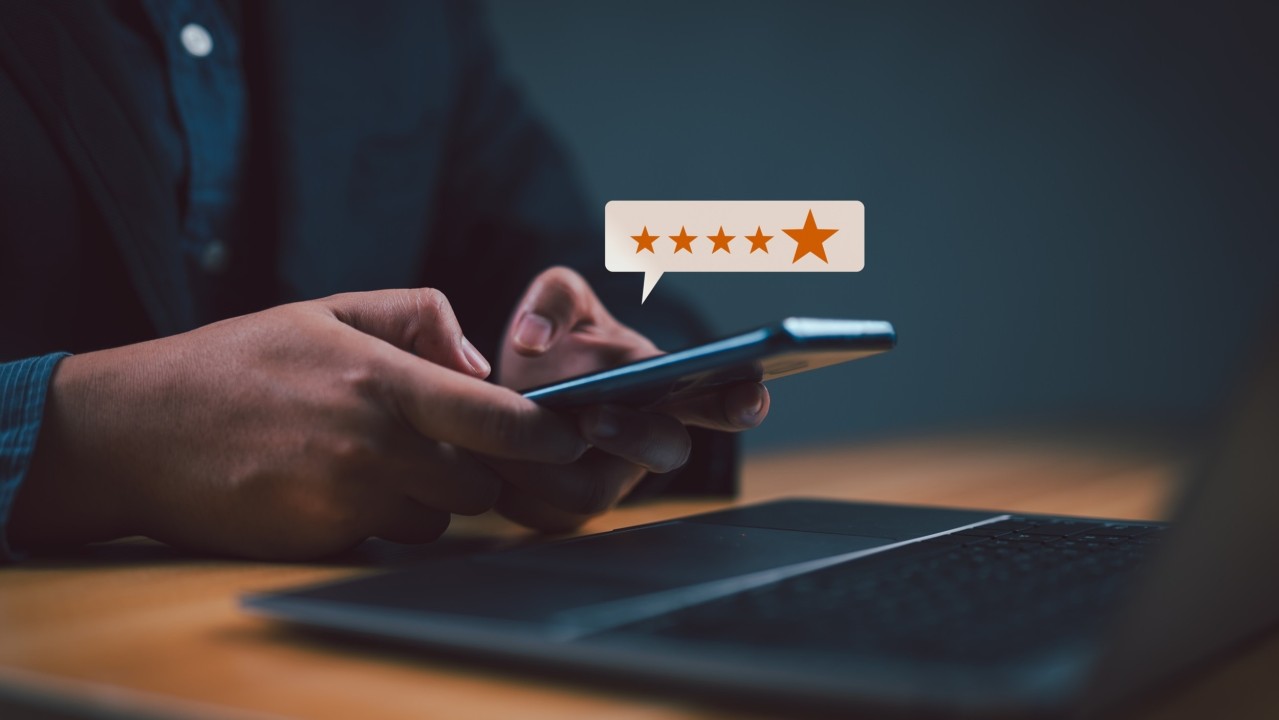 people sitting at at desk smiling